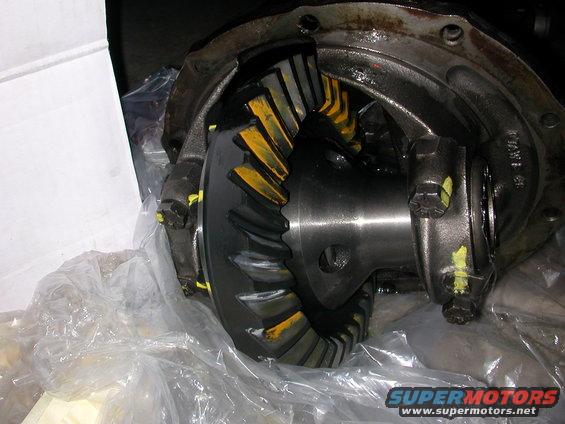 Differential gears with yellow markings, wrapped in plastic