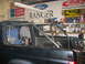 1992 Ford Bronco - Custom roll cage installed in the interior of a black SUV, with various tools and supplies visible in the background.
