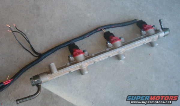 Fuel rail with four injectors and wiring harness