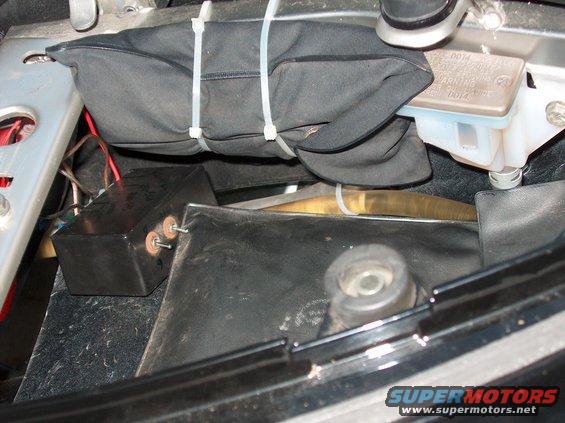 motorcycle brake fluid reservoir and black box with wires