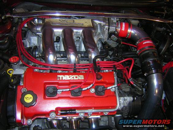 Mazda engine with red valve cover and chrome intake manifold