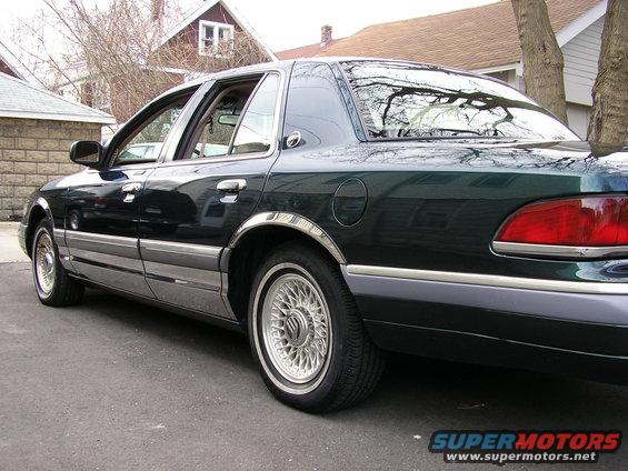 Dark green 1994 Mercury Grand Marquis rear quarter view