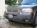 1994 Ford Bronco - Front view of a gray Ford Escape, showing the grille and headlights.
