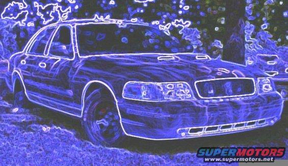 Front 3/4 view of a 2001 Ford Crown Victoria parked outside. Another vehicle is visible behind it
