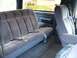1986 Ford Bronco - The plush blue interior of a 1986 Ford Bronco, a rear bench seat and front bucket seats.