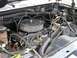 1986 Ford Bronco - A close-up view of a vehicle's engine compartment, showing various components and wiring.
