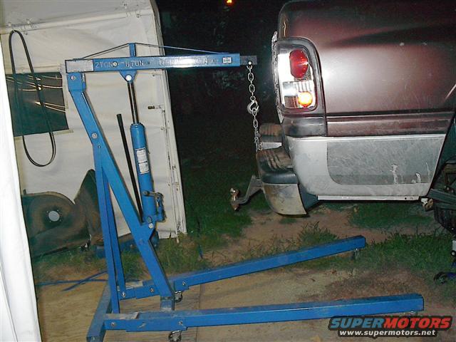 Engine hoist attached to the rear bumper of a 1997 Dodge 1500 pickup truck