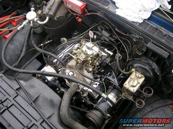 Engine bay of a 1979 Chevrolet C/K Pickup with a V8 engine, carburetor, and MSD ignition