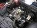 1979 Chevrolet C/K Pickup - The engine bay of a 1979 Chevrolet C/K Pickup, showing its V8 engine with a carburetor and MSD ignition box.