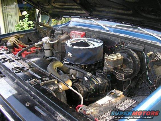 Blue 1979 Chevrolet C/K Pickup engine bay with chrome air cleaner and visible battery