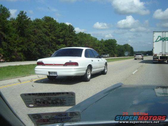 Rear view of a white 1992 Ford Crown Victoria on the highway