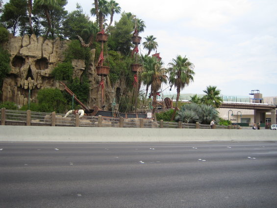 Pirate ship attraction with skull rock and palm trees