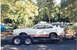1978 Ford Mustang II - A white 1977 Ford Mustang II Cobra II is transported on a trailer, a distinctive red stripe and badging.