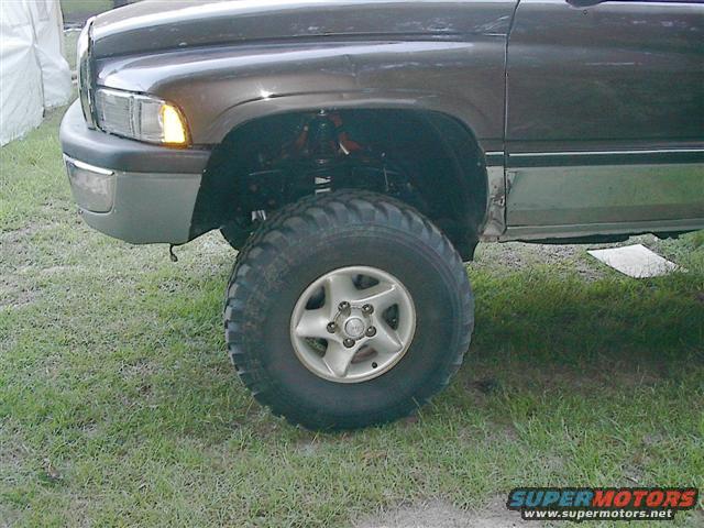 1997 Dodge 1500 front fender, headlight, bumper, and wheel with off-road tire