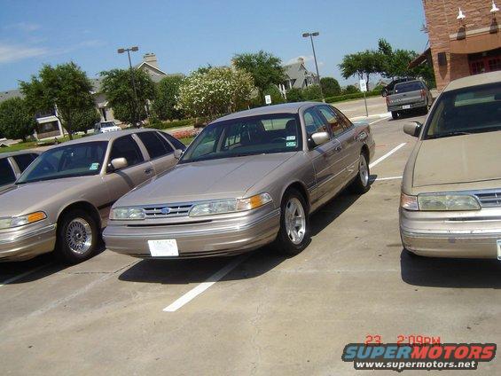 Tan 1992 Ford Crown Victoria sedan parked in a lot, front quarter view