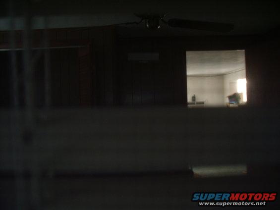 Interior scene with ceiling fan and window view
