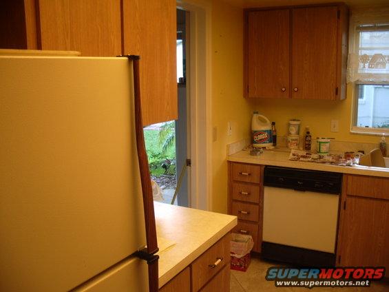 Kitchen with refrigerator, cabinets, dishwasher, and sink