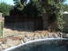 1994 Ford Bronco - Backyard scene includes a pool, rocks, wooden fence, and a wire enclosure.
