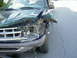 1996 Ford Explorer - Front-end collision damage on a green 1996 Ford Explorer, with airbags deployed.
