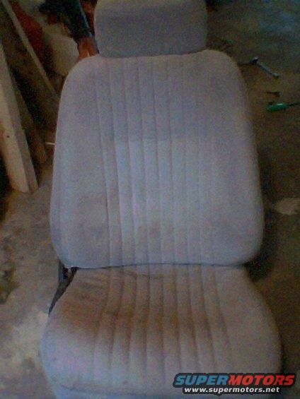 Gray fabric car seat with vertical pleats. Bottom cushion is separate from the backrest