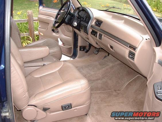 Interior of a 1994 Ford Bronco showing tan leather seats and dashboard