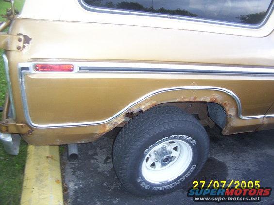 Passenger side Quarter Panel, badly rusted.