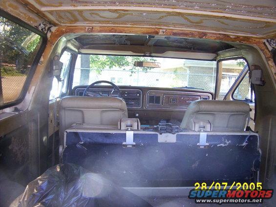 Interior shot.  Use to have a header liner with insultation on the cap area in the rea but was shot.  IS striped out to re do it after the painting.  (getting that adhesive off is going to be fun!  :(  )