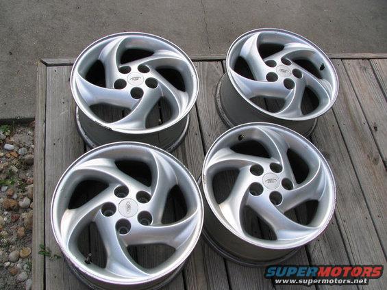 swirly.jpg Stock '95 Rims. A little rash on the lip of 3 of them. Otherwise in good shape. Good paint, good shine.