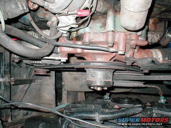 Engine bay showing belts and pulleys
