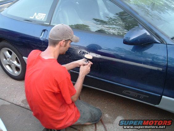 dscf1261.jpg David using an eraser air-tool to get the adhesive from the door-ding-guards off
