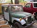1973 Jeep CJ5 - This 1973 Jeep CJ5 has a unique custom utility body and is parked next to a red Ford Bronco.