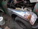 1973 Jeep CJ5 - A Jeep CJ-series vehicle is shown with its hood open, revealing the engine and undergoing bodywork.
