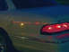 1993 Ford Crown Victoria - The neon signs reflecting off the paint. Note the dark blue twilight sky reflection on the trunk lid.