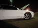 1993 Ford Probe - A white coupe sits with its hood open at night, showing a GT badge on the side.