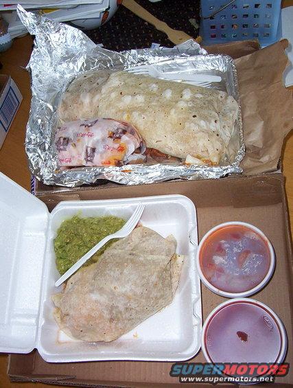 Burritos and guacamole in takeout containers