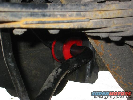 Red sway bar bushings installed on a black sway bar