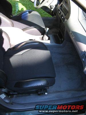 Interior of a 1995 Ford Taurus showing front seats and dashboard