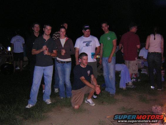 Group of people gathered outdoors at night