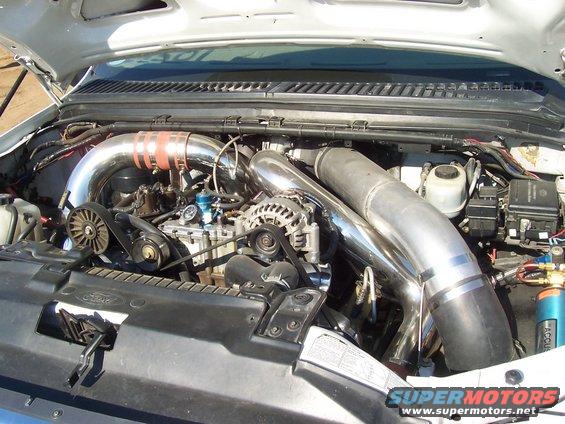 Engine bay with large chrome turbo pipes and intercooler hoses
