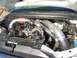 1994 Ford F-150 - Custom turbo piping installed in an engine bay, showing modified intake and exhaust systems.