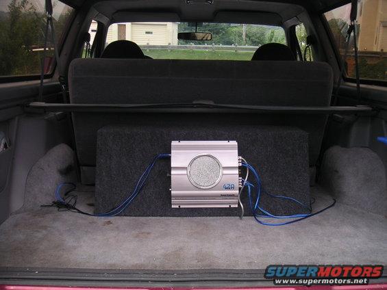 1994 Ford Bronco interior showing subwoofer box and amplifier
