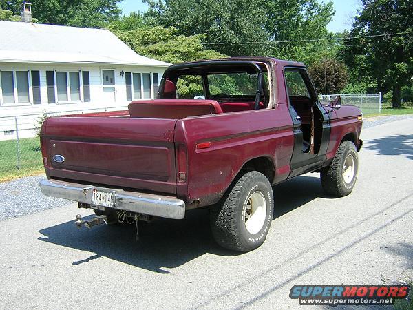 Maroon 1978 Ford Bronco, rear view, removable top off, doors open