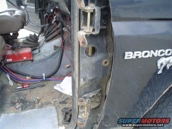 picture-249.jpg Then I cut the old pins in half with a 1/8" cut off disk then seperated them with a long 3/8" screwdriver, then I pounded out the pins, then removed the other half of the hinge.  I then pounded out the bushings.  I also used a drill to make the bushings easier to slide out, and a 3/8" chisel to pound them out as well.
carefully set the new bushings, slide the hinge half back on, put in the pin then insall the E clip.  Put your door back on and happy closing!