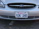 1995 Ford Taurus - Front view of a 1995 Ford Taurus, the Ford emblem on the grille and a California license plate.