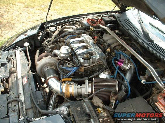 Engine bay with turbocharger and chrome valve cover