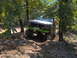1978 Ford Bronco - Modified pickup truck with green bumper and winch navigating a dirt trail.