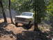 1978 Ford Bronco - This Ford Bronco navigates a challenging off-road trail, kicking up dust.