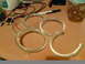 1997 Ford Probe - Close-up of four clear plastic rings with visible wiring, likely automotive lighting components.