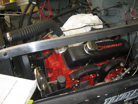 Close-up of a Chevrolet engine with red block and black valve covers