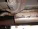 1985 Ford Ranger - Close-up of a Flowmaster exhaust component, showing rust and weld marks.